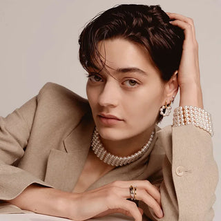 Tisento - Silvur oyrastikk við lítlari perlu